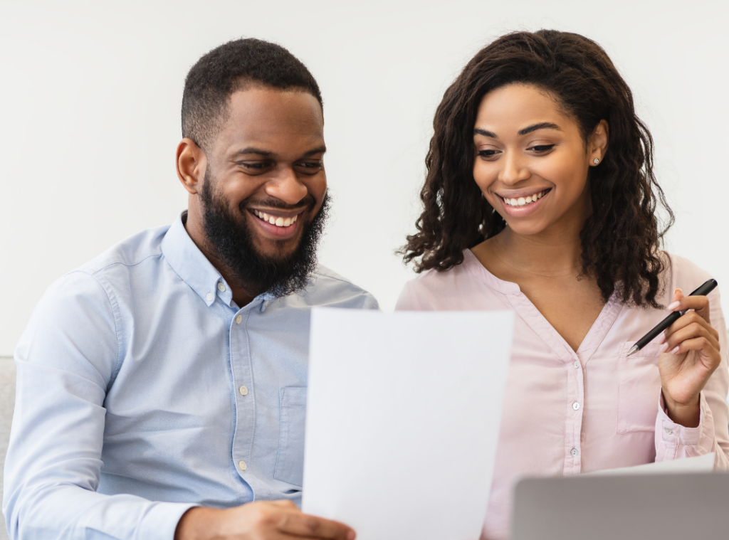 african american couple looking at a document they about to sign