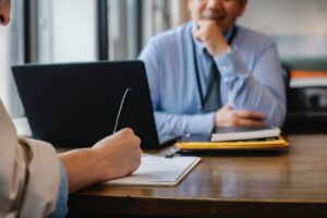 douglass runger Woman filling job application form in office with boss commercial contract